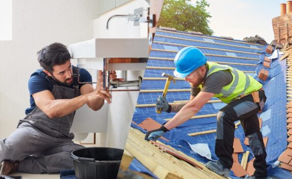 Split image showing a plumber repairing a sink on one side and a construction worker replacing a roof on the other, illustrating the difference between repairs and improvements for real estate investors.