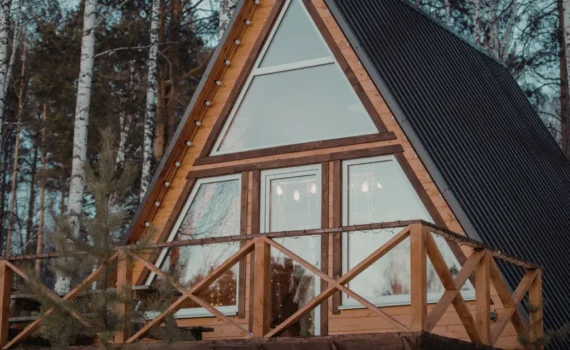 A-frame cabin in the woods representing a short-term rental property used for tax strategy