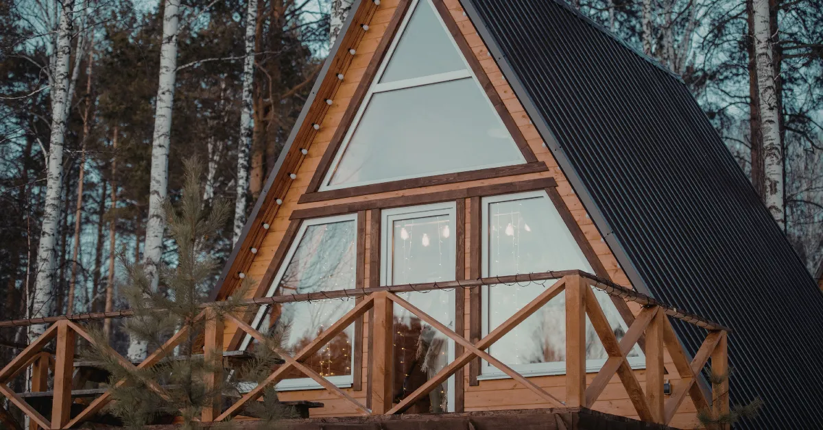 A-frame cabin in the woods representing a short-term rental property used for tax strategy